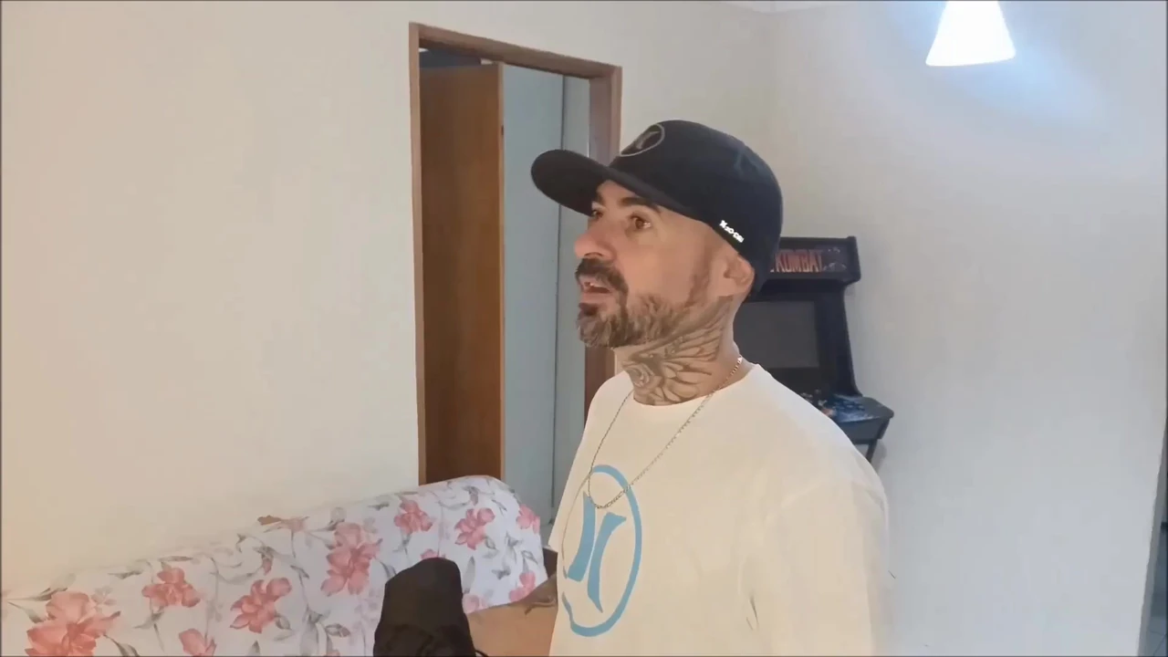 seamstress measuring customer’s pants with erection